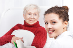 caregiver taking care of the elder woman